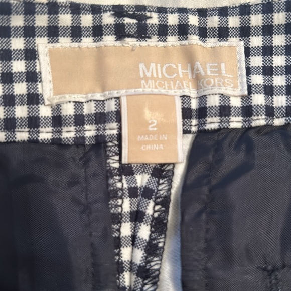 Two pairs of Michael Kors shorts size two.One solid black other navy and white - Picture 2 of 4